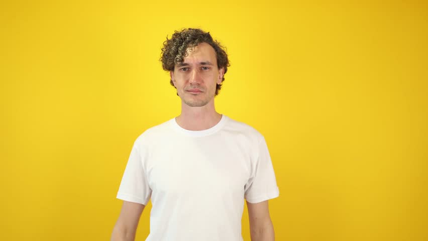 Joyful young man pointing himself with index fingers nodding in agreement, isolated yellow studio background charismatic visual lifestyle branding, motivational campaigns, World Smile Day promotions