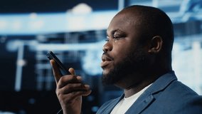 African american expert engaged in a phone call chat about machine learning, surrounded by a virtual interface showcasing AI brain data visualization and high tech innovation. Camera B. - Powered by Shutterstock - Get 15% off with code: PIKWIZARD15