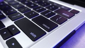 Close-up of a man's fingers typing on a laptop keyboard and pressing the Enter key (return key), illustrating digital work or communication - Powered by Shutterstock - Get 15% off with code: PIKWIZARD15