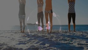 Group of four women on beach syncing yoga for wellness responding to rotating holographic globe. Wellness, harmony, mindfulness, digital, connection, outdoor, tranquility - Powered by Shutterstock - Get 15% off with code: PIKWIZARD15