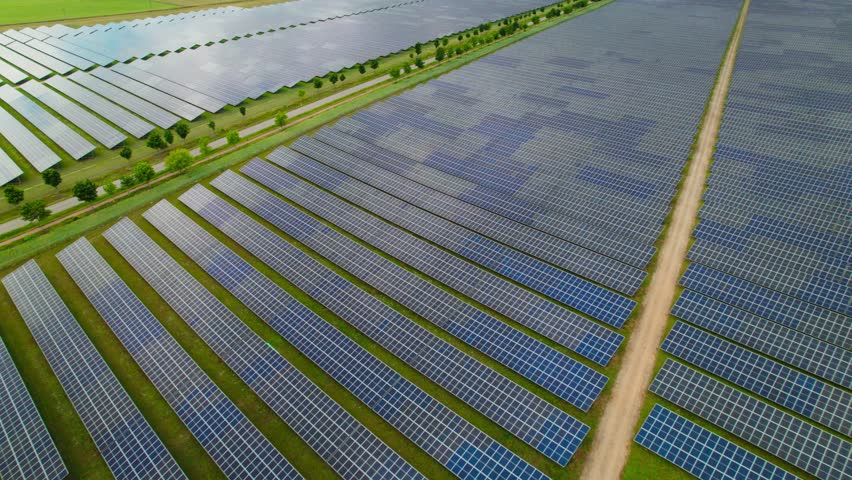 Electric car crosses solar farm renewable energy from Poland’s energy plant