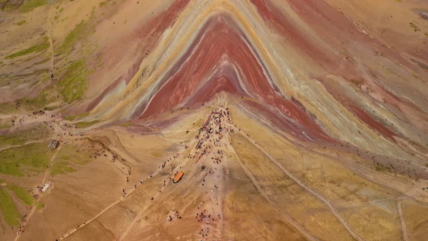 Rainbow mountain in Peru, aerial view showing colored layers and visiting hikers - Powered by Shutterstock - Get 15% off with code: PIKWIZARD15