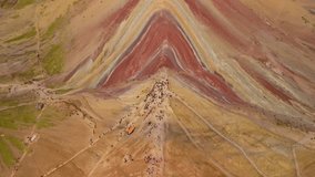 Rainbow mountain in Peru, aerial view showing colored layers and visiting hikers - Powered by Shutterstock - Get 15% off with code: PIKWIZARD15