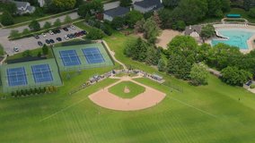 Baseball Players Playing During Match On A Sunny Day. Aerial shot  - Powered by Shutterstock - Get 15% off with code: PIKWIZARD15