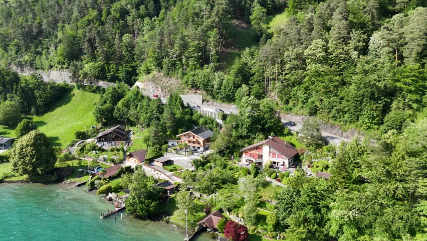 Lake side houses on Lake Thun Interlaken Jungfrau region Switzerland drone,aerial
