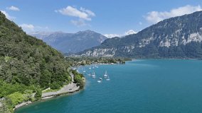 Lake Thun turquoise water Interlaken Jungfrau region Switzerland ascending drone,aerial - Powered by Shutterstock - Get 15% off with code: PIKWIZARD15