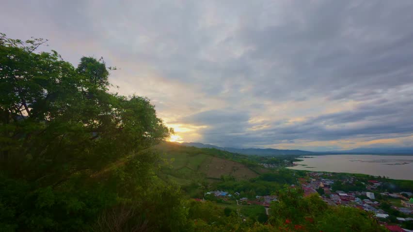 Scenic Sunset Over Lake and Town Landscape