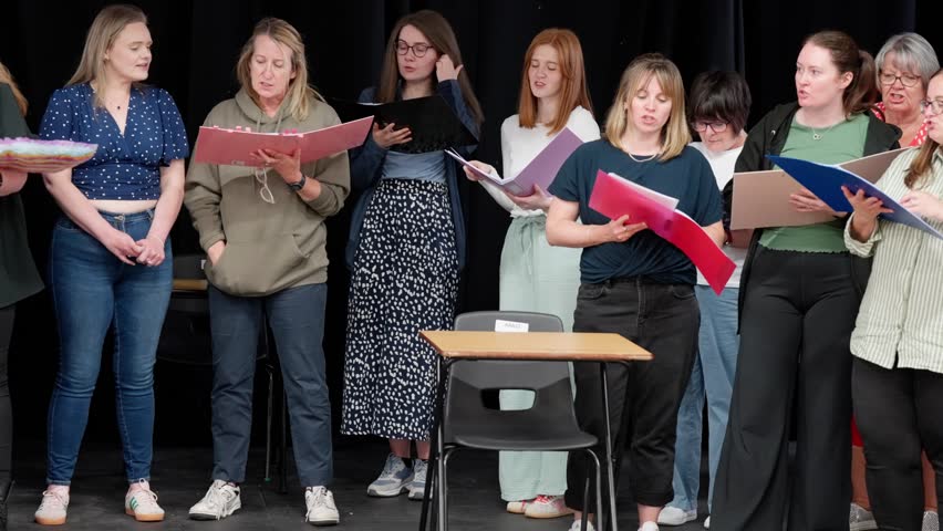 Musical singing cast members, expressive artistic group rehearsals