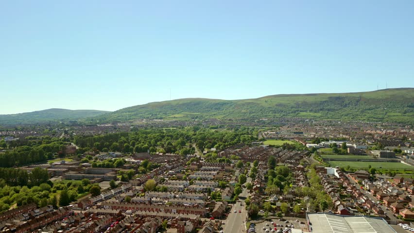 Wide advancing aerial video of the Black Mountain and surrounding area in West Belfast, Northern Ireland on a bright summer day. Filmed in 4K, 60fps and with Rec709 color.