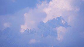 Timelapse of Mountain Peaks Surrounded by Moving Clouds - Powered by Shutterstock - Get 15% off with code: PIKWIZARD15
