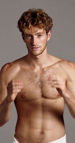 Face, hair and smile of shirtless man in studio for masculine grooming, hygiene or skincare. Body, fitness and health with happy muscular model on gray background for transformation or wellness