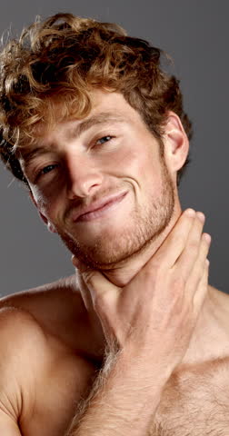 Happy, beard and grooming with face of man in studio for growth, shine and self care. Skincare, beauty and smile with male person on gray background for glow, treatment and facial hair hygiene