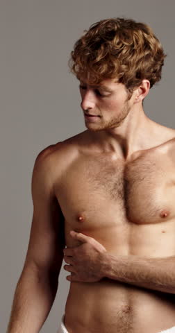 Bicep, face and smile of shirtless man in studio for masculine grooming, hygiene or skincare. Body, fitness and wellness with happy muscular model on gray background for health or transformation