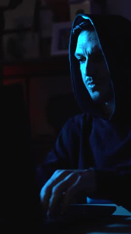 Modern hacker typing on laptop representing cyberattack, identity theft and computer virus threats