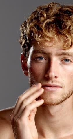 Beauty, face and smile of man in studio for hygiene, masculine grooming or skincare wellness. Aesthetic, cleaning and self care with happy model on gray background for change or facial dermatology