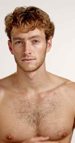 Beauty, face and smile of shirtless man in studio for masculine health, hygiene or wellness. Aesthetic, body and skincare with happy or muscular model on white background for cosmetics or dermatology