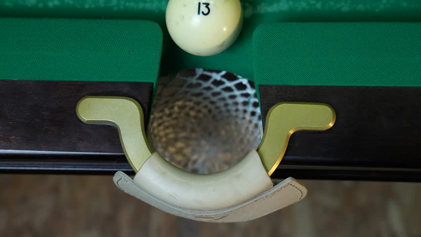 Russian billiards blow cue over the ball, unsuccessfully. Close-up.