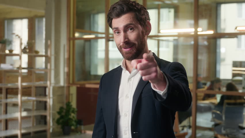 Glad Caucasian man business businessman pointing at camera thumbs up in office smiling entrepreneur executive gesturing you manager guy male showing approve gesture good job excellent result success