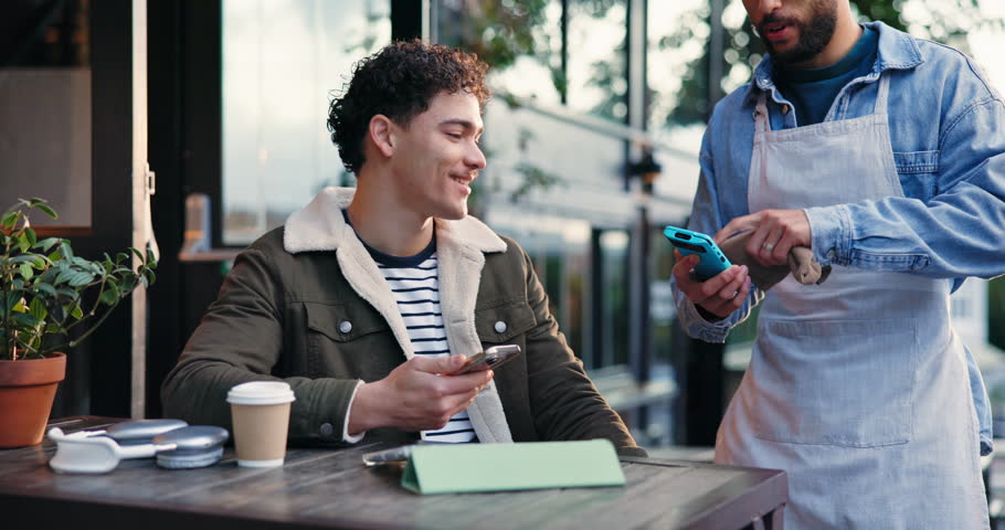 Happy man, customer and waiter with pos machine at cafe for phone payment, transaction or purchase. Male person, host and service with mobile smartphone for tap to pay, NFC or scan at coffee shop