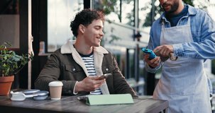 Happy man, customer and waiter with pos machine at cafe for phone payment, transaction or purchase. Male person, host and service with mobile smartphone for tap to pay, NFC or scan at coffee shop - Powered by Shutterstock - Get 15% off with code: PIKWIZARD15