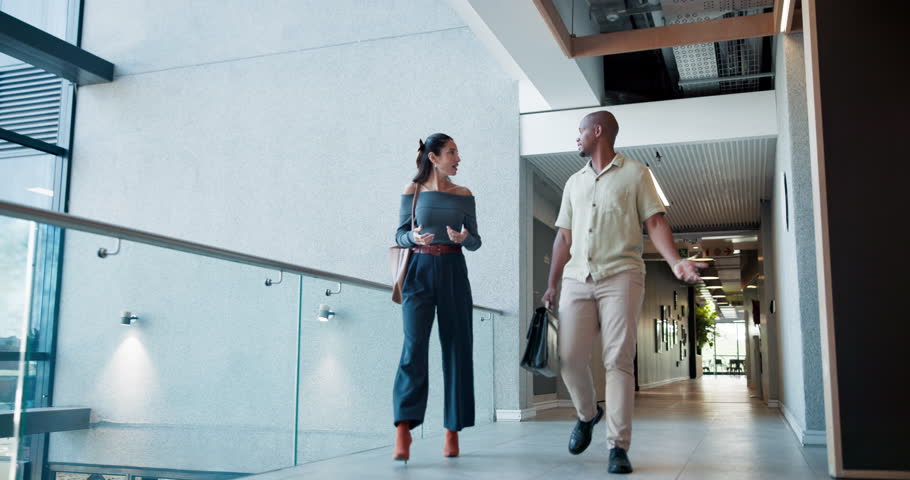 Business, employees or walking to meeting with discussion for story ideas, article pitch or news. Journalism, low angle or people at publishing agency with sharing information or publication feedback