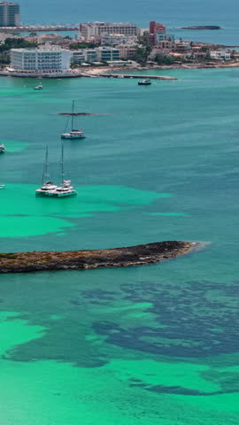 Turquoise waters gently lap against the pristine white beaches of playa d'es trenc in mallorca, spain