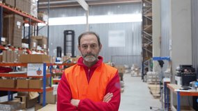 Senior male worker wearing a safety vest smiles in a warehouse, showing various facial expressions - Powered by Shutterstock - Get 15% off with code: PIKWIZARD15