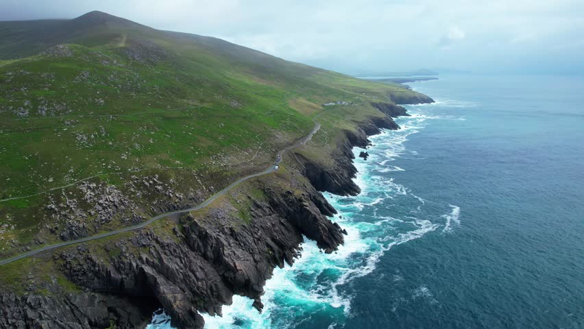 Slea Head Drive road high above cliffs and breaking waves and Atlantic swell Kerry Ireland Epic Locations