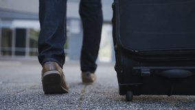 Suitcase, travel and businessman on global journey for finance career. Luggage, walking and professional male financial executive with baggage for trip outdoor in urban city.  business person hand - Powered by Shutterstock - Get 15% off with code: PIKWIZARD15
