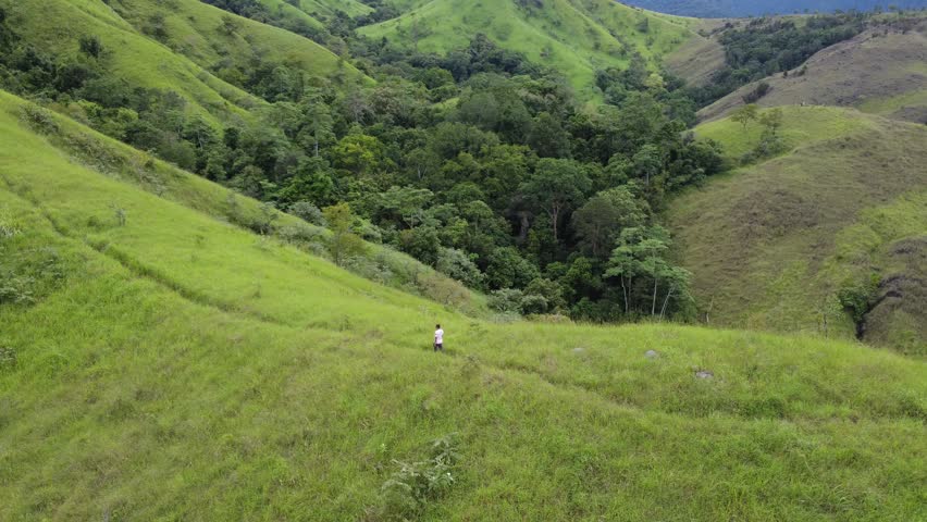 4k footage Drone Aerial hills with expanses of green grass savanna