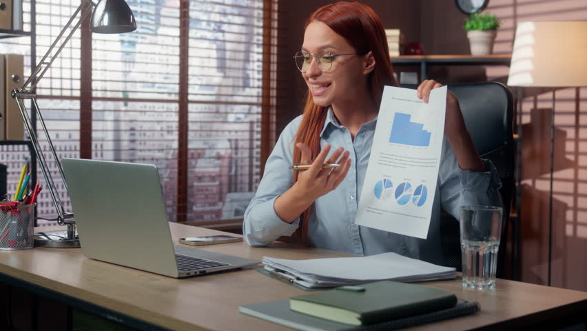 Happy smiling successful businesswoman business woman in office talking video call with laptop showing graph diagram good result financial growth document girl work Caucasian female online conference - Powered by Shutterstock - Get 15% off with code: PIKWIZARD15