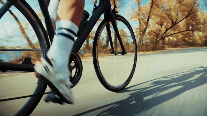 cyclist riding on road bike. cyclist pedaling on road bike. Cycling gears speed energy. Outdoor sports and fitness lifestyle. Cycling motion sport challenge. Fitness hobby. Cycling effort pedal force