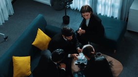 Top view of professional business people analyze stock market investment data by using laptop and financial graph while smart businessman walk out of the meeting room. Creative business. Directorate. - Powered by Shutterstock - Get 15% off with code: PIKWIZARD15
