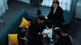 Top view of professional business people analyze stock market investment data by using laptop and financial graph while smart businessman walk out of the meeting room. Creative business. Directorate. - Powered by Shutterstock - Get 15% off with code: PIKWIZARD15