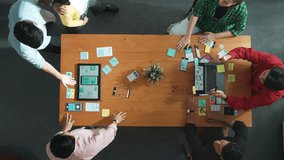 Top view of developer and designer shake hand together at meeting. Software developer handshake and working together with programmer to develop Ux Ui desifn for mobile phone interface. Convocation. - Powered by Shutterstock - Get 15% off with code: PIKWIZARD15