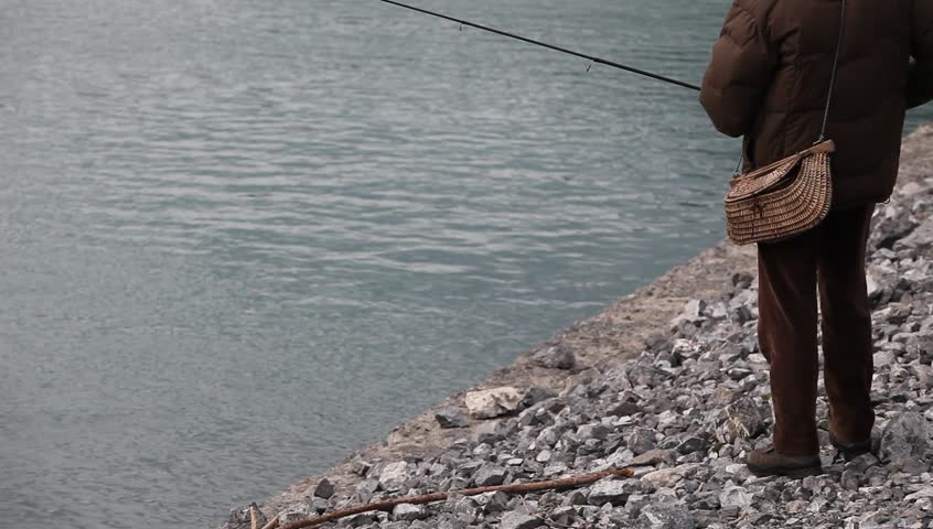 man fishing on the lake