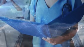 Nurse scanning clipboard activating network overlay monitoring hospital ward smiling at camera. Medical staff, healthcare, digital integration, telemedicine, patient care, modern clinic, technological - Powered by Shutterstock - Get 15% off with code: PIKWIZARD15