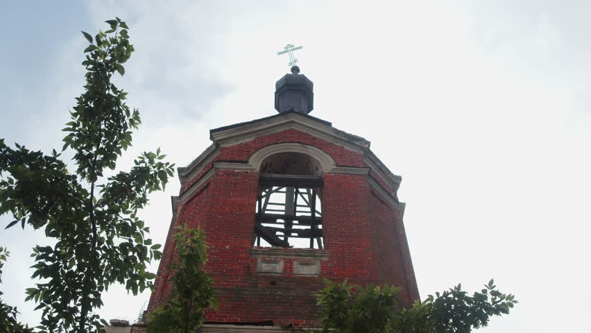 The bell tower of the Orthodox church, constructed in the 19th century, fell into disuse and disrepair during the Soviet era.
