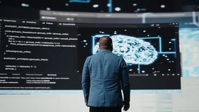 Black professional software engineer programming for tech innovation, reviewing data and binary code on the dashboard. IT specialist examining programming language for transformation. Camera A. - Powered by Shutterstock - Get 15% off with code: PIKWIZARD15