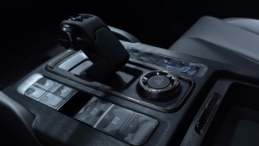Modern premium car, gear shifting. close up. 