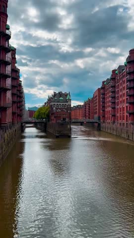 Bridge, canal and houses the Speicherstadt, Hamburg, Germany, May 19, 2025. High quality 4k footage