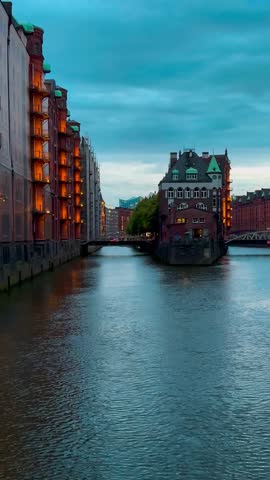 Bridge, canal and houses the Speicherstadt, Hamburg, Germany, May 19, 2025. High quality 4k footage