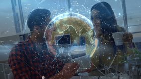 Man tapping smartphone showing tech globe overlay while coworker sipping coffee and jotting notes. Collaboration, innovation, digital, futuristic, workspace, communication, technology - Powered by Shutterstock - Get 15% off with code: PIKWIZARD15