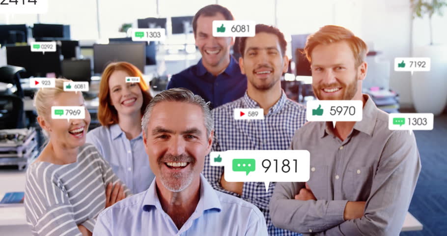Business team standing watching comment bubble fading spawning engagement icons showing growth. Collaboration, teamwork, digitalmetrics, modernoffice, success, analytics, productivity