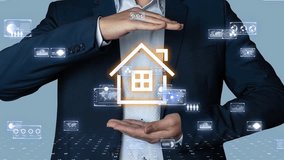 Businessman holding a glowing smart home icon with data interfaces floating around, futuristic IoT concept - Powered by Shutterstock - Get 15% off with code: PIKWIZARD15