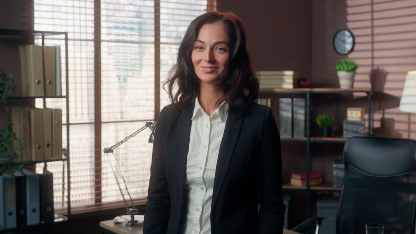 Happy successful Caucasian woman businesswoman smiling holding stack of money banknotes dollars girl rich female business leader office manager employer entrepreneur finance income wealth cash profit