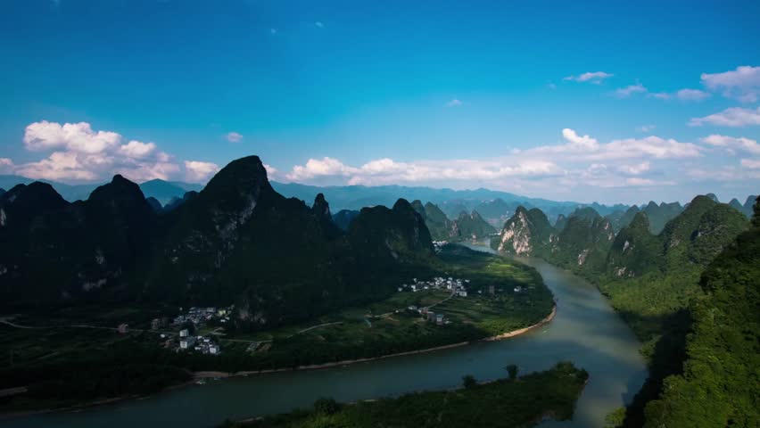 Mountains and river landscape under a blue sky