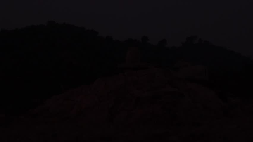Time lapse golden light in with sunrise.
Time-lapse night to day.silhouette Lord Shiv Ling and Nandi..