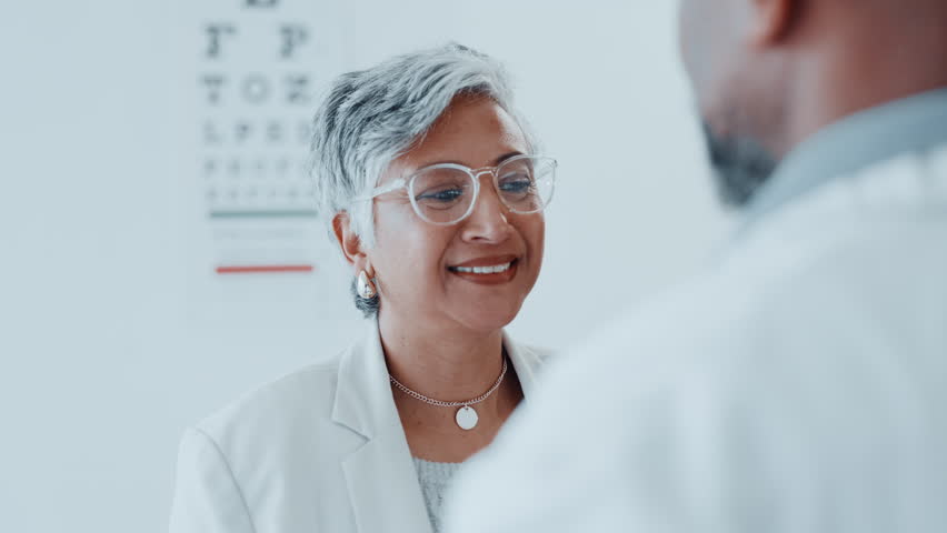 Eye exam, fitting or glasses with optometrist and woman in clinic for prescription frame lenses. Eyewear, laughing or vision with mature client and ophthalmologist in hospital for appointment