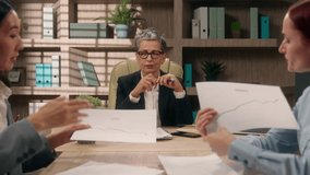 Excited multiethnic team discussing talking Caucasian Asian women females in office business diversity businesswomen showing charts graphs discuss financial project coworkers strategy plan briefing - Powered by Shutterstock - Get 15% off with code: PIKWIZARD15